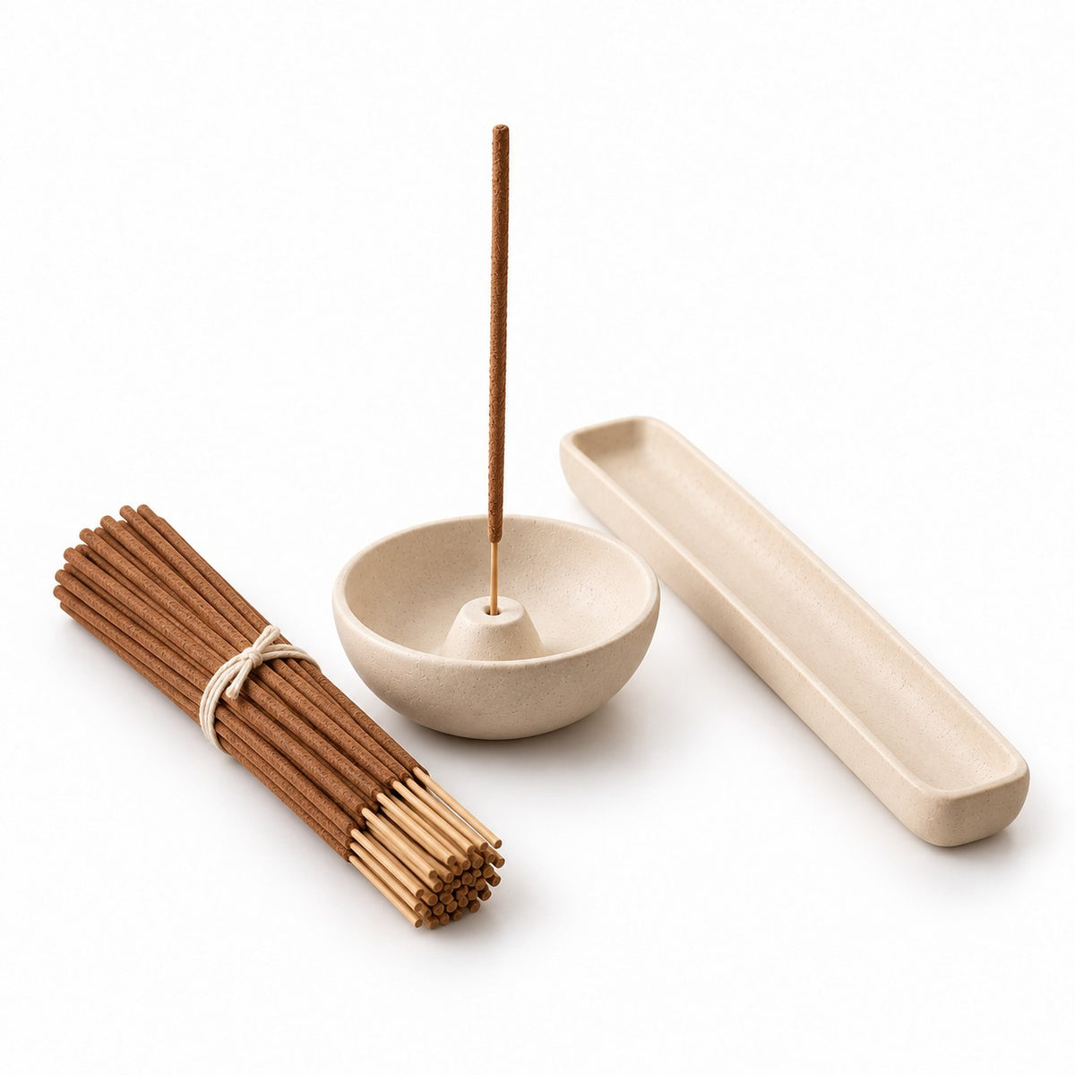 Palo santo incense set: tied bundle of sticks, ceramic bowl holder and long tray on a white background