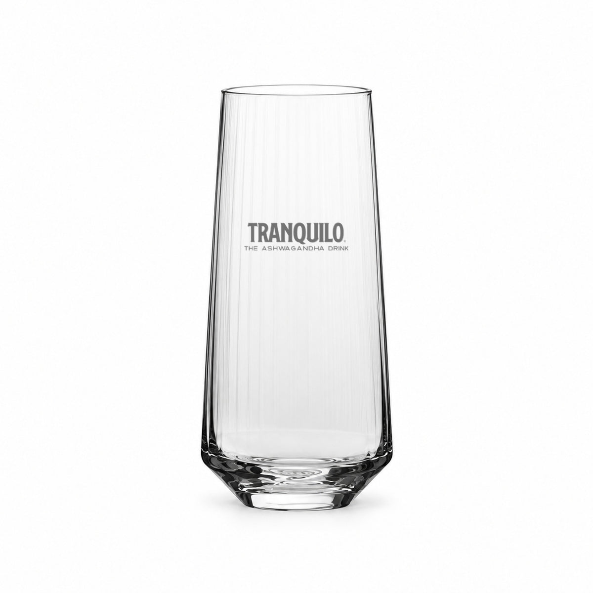 Highball glass with fine vertical ribs, engraved with the Tranquilo logo