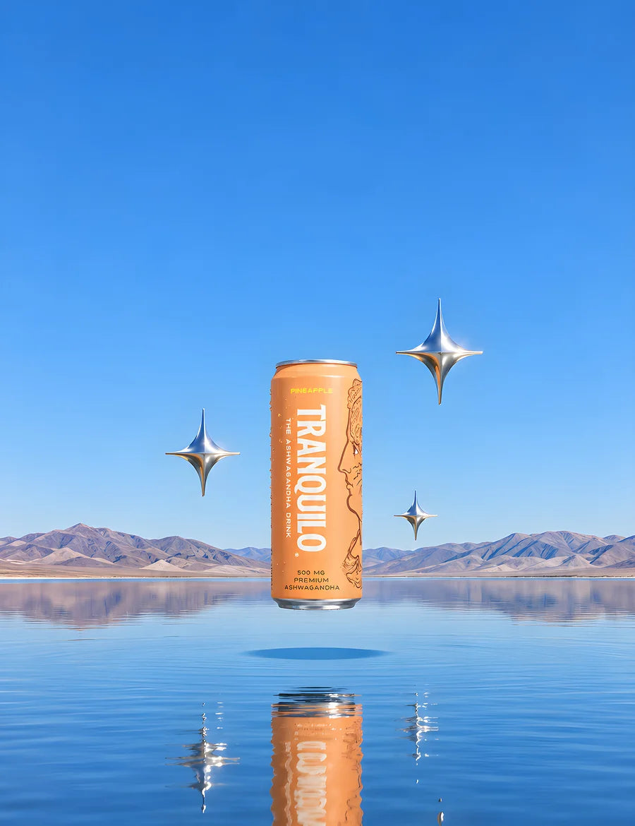 A can of Tranquilo Pineapple floating above a mirror-calm lake